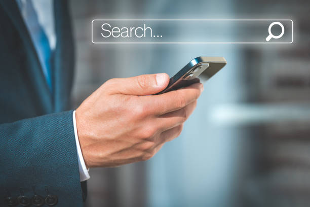 istock Man searching browsing internet data information in mobile smartphone. Businessman clicking internet search bar. Online search. Networking concept 1359589676