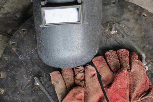 istock welding helmet and welding gloves, construction worker protective equipment concept 1359589873