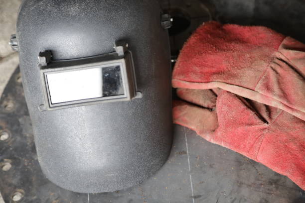 welding helmet and welding gloves, construction worker protective equipment concept