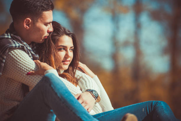 istock Happy couple hugging in the park 1359591334
