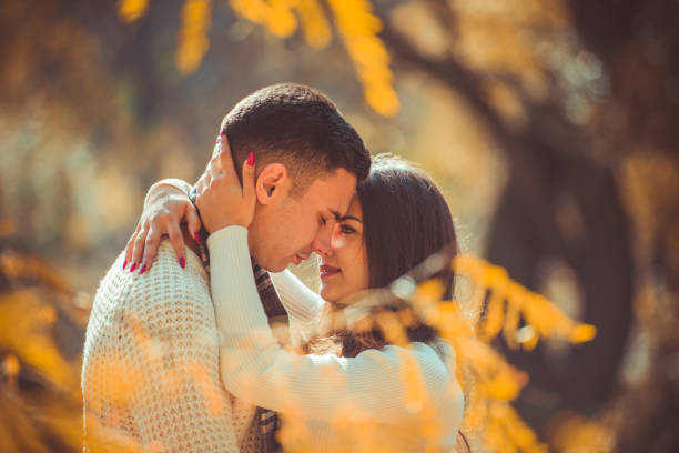 istock Sweet couple looking happy in nature 1359591464