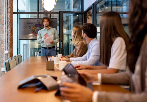 istock Business man making a presentation in a meeting at the office 1359591909