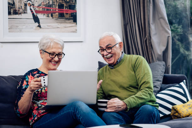 istock Happy senior couple surfing the web together 1359592831