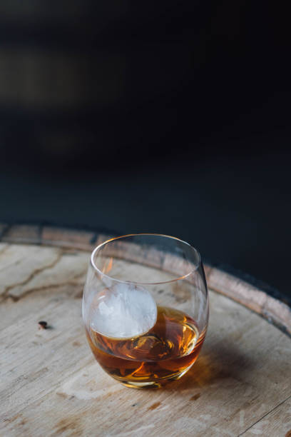 istock glass of  whiskey with sphere ice 1359594556