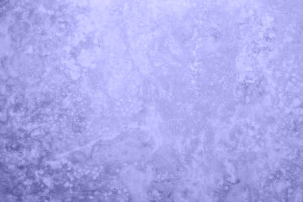 istock Defocus of Abstract rustic marble texture, soft natural beige texture background, granite ceramic tile. photo toned in the color of the year very peri. 1359596477