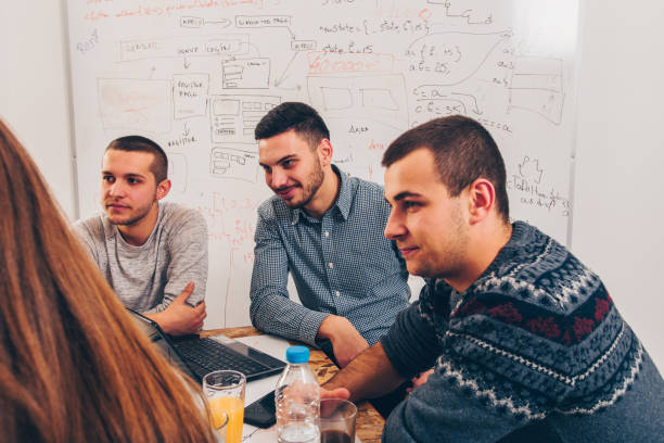 istock Colleagues discussing in the room 1359601763