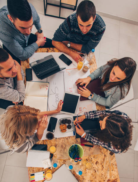 istock Businessmans talking in the office 1359601764