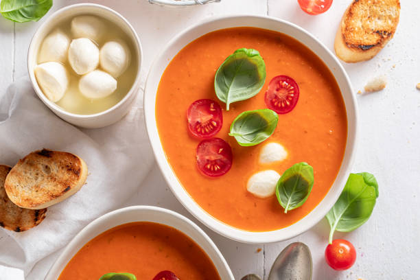 istock Healthy creamy tomato soup with mozzarella cheese and crostini. 1359603707