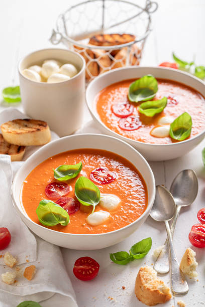 istock Vegan creamy tomato soup with mozzarella cheese and crostini. 1359603710