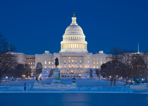 At night, lights illuminate the United States Capitol Building and the Washington Monument, Washington, D. C.