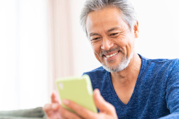 istock elderly man who uses smart phone, 1359613939