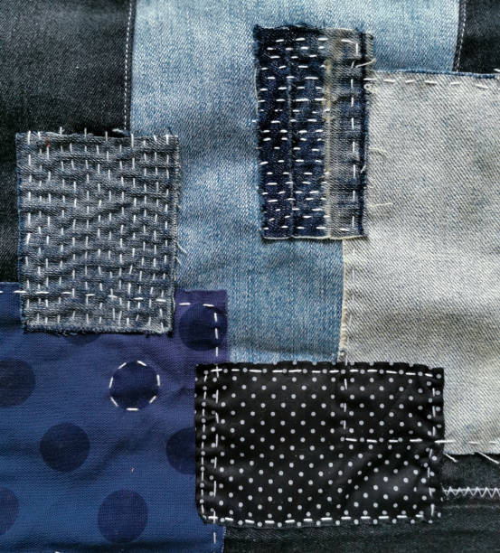 istock Mixed fabric, denim jeans, blue polka dot pattern printed, black denim and white stitched decoration 1359617602