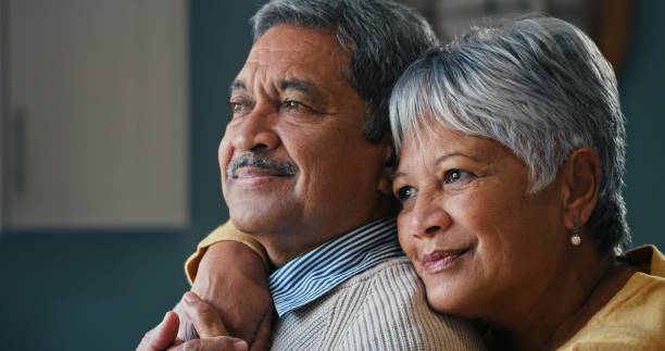 istock Shot of a happy senior couple looking thoughtful at home 1359617708