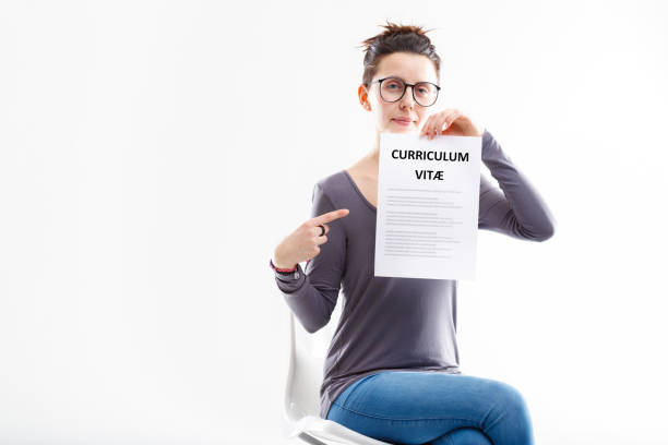 istock young woman sat showing her well done resume 1359620017