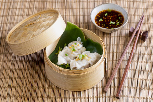 istock Chinese dim sum in a bamboo steamer box 1359620878