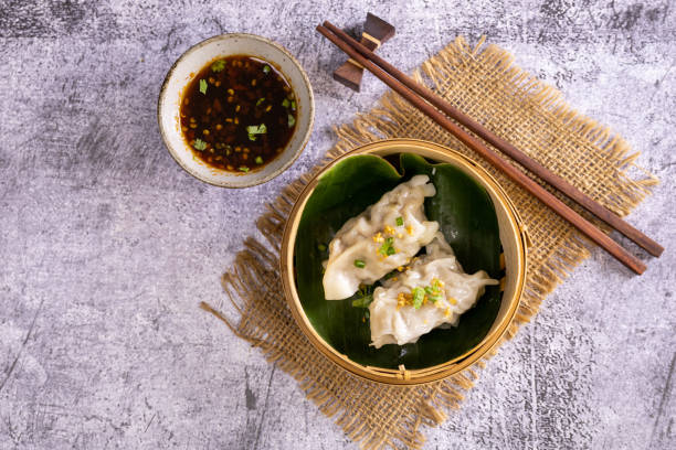 istock Chinese dim sum in a bamboo steamer box 1359620887