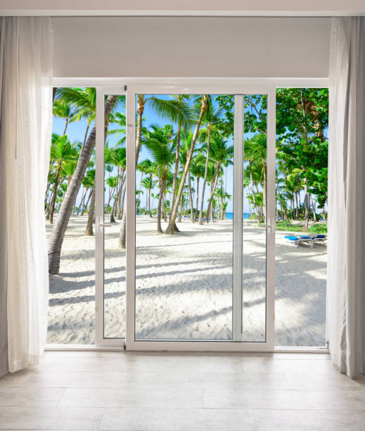 istock large glass door overlooking the beach 1359622904