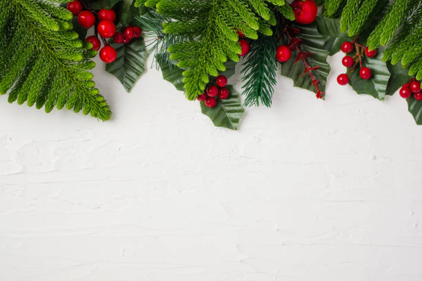 istock christmas pine leaf and mistletoe on white paster concrete table 1359623051