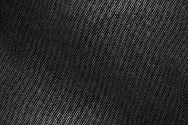 istock Dark gray shiny rough cotton fabric texture for background 1359623699