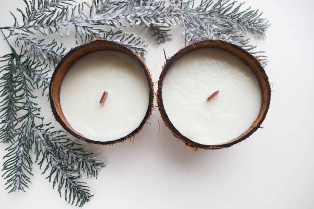 istock original decorative handmade candle in a coconut. natural soy wax candle 1359628497