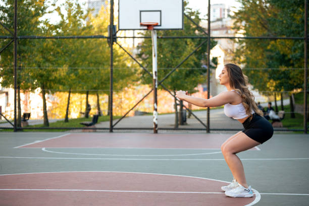 istock Fitness woman doing squats 1359628575