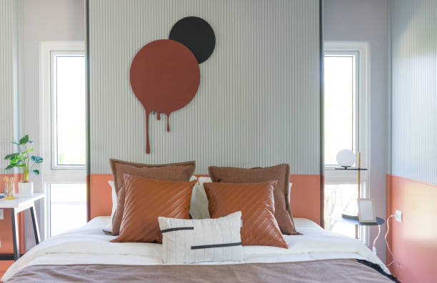 istock Modern stylish bedroom with brown and leather pillows setting. 1359634227