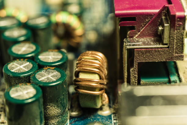 istock Fragment of a computer motherboard with electronic components, close-up 1359640221