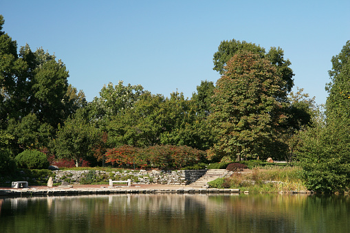 Relaxing Park Scene. Cox Arboretum and Gardens Metropark.  Dayton, Ohio.  Green Trees, Blue Sky, Water.