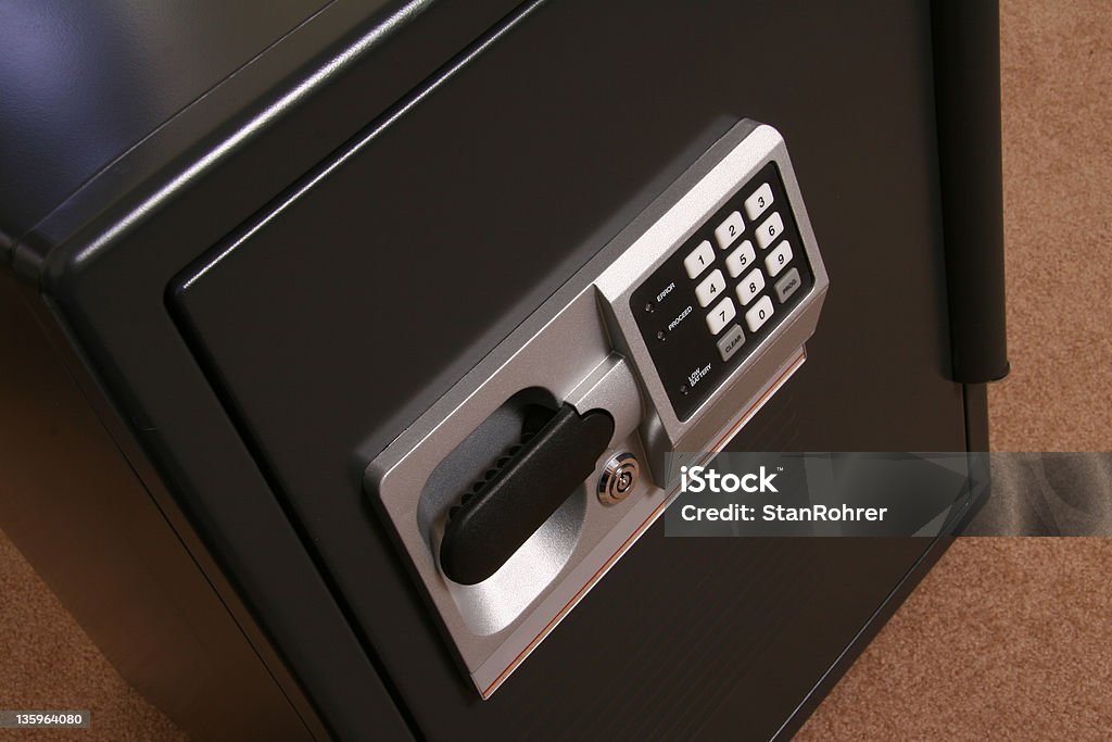 Small Business Safe III Small Business Safe. Large household safe. Fire Safe. Lock box. Combination and key locks. Focus is on the keypad and handle. Cash Box Stock Photo