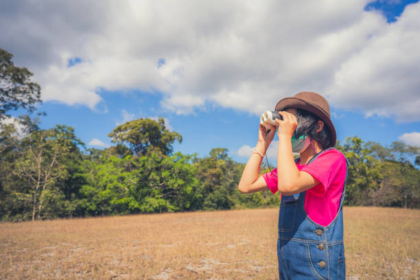 istock Children playing and travel on grassland on blue sky background 1359641205