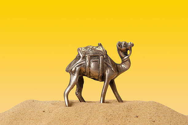 istock figurine of a camel made metal, isolation 135964155