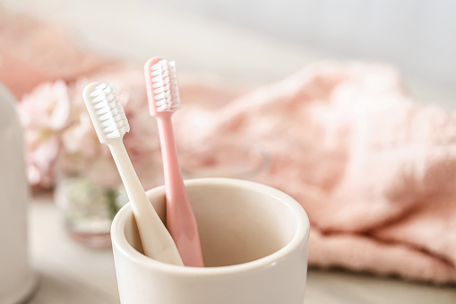 Toothbrush, toothpaste, washbasin, amenities, white, pink