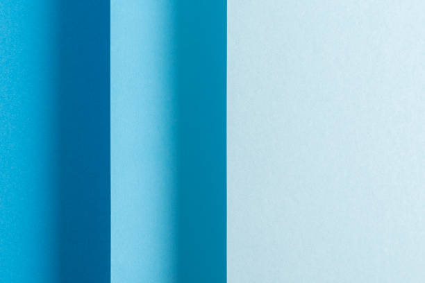 istock Colorful blue folded paper material design vertically. Top view, flat lay 1359647121