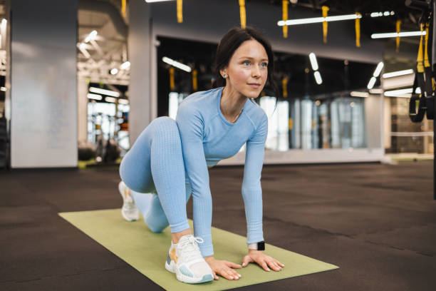 istock Woman doing stretching in the gym. Pilates exercise 1359649427