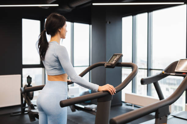 istock Athletic woman on a treadmill 1359649526