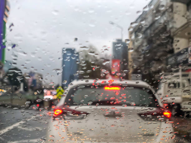 istock rain droplets on windshield from inside of car in traffic jam in a rainy day 1359653616
