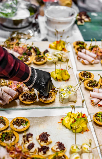 istock Chef hand is in process of Preparing catering food 1359654588