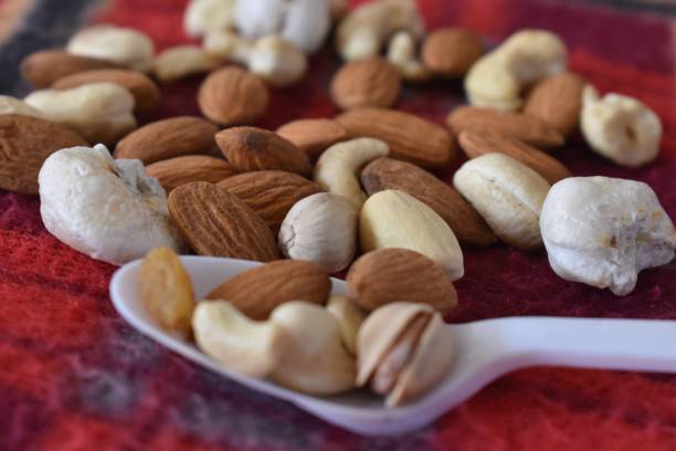 istock mixed nuts and tropical dry fruits 1359655368
