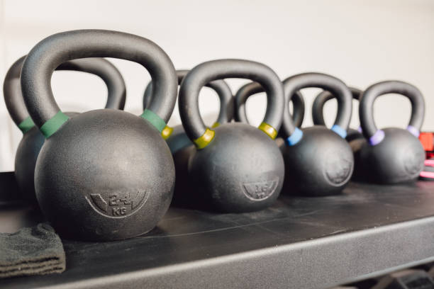 istock Kettlebells on rack for strength training in gym. 1359655467