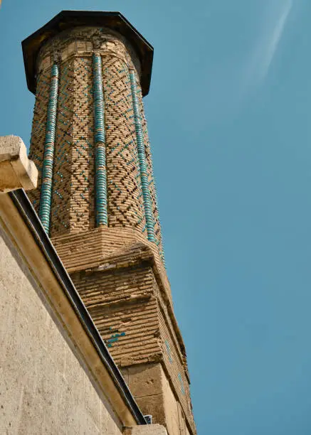 Minaret of mosque, local name is ince minareli cami, in Konya Turkey. Mosaic arts on minaret
