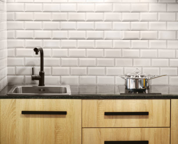 istock Steel pan and stewpan standing on kitchen stove 1359655895