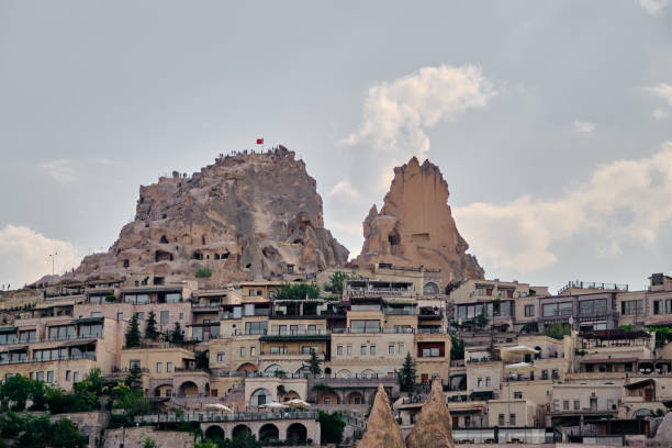 Cappadocia, Goreme, limestone castle Cappadocia, Goreme, limestone castle called as uchisar and houses at mountain foot of castle uchisar stock pictures, royalty-free photos & images