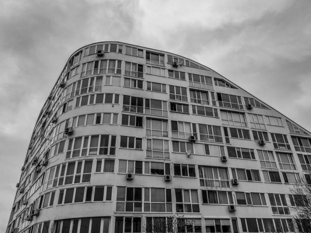 Modern abstract building in black and white. Dramatic sky.