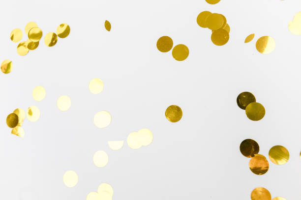 istock golden confetti on white background flat lay text place - Image 1359657124
