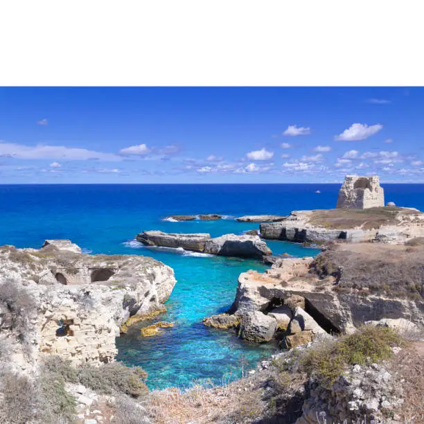 Typical seascape of Salento: cliff and ruins of ancient coastal watchtower. Roca Vecchia or Rocavecchia is a coastal resort of Salento and one of the marinas of Melendugno, in the province of Lecce. It overlooks the Adriatic Sea and is located between San Foca and Torre dell'Orso.