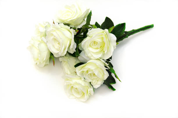 istock Bouquet of artificial white roses on white background 1359668328
