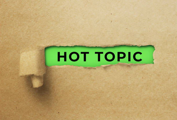 istock Torn and twisted paper strip revealing hot topic 1359669653
