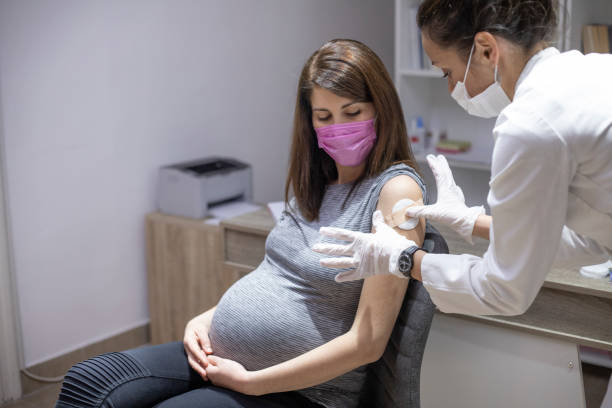 istock Pregnant woman getting vaccinated 1359670860