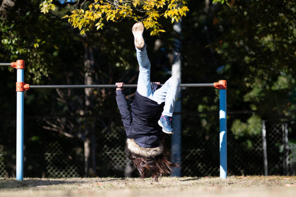 istock Girl playing on the horizontal bar 1359670997