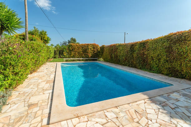 istock Rectangular swimming pool in typical Mediterranean architecture in the garden in summer. For tourists 1359671539